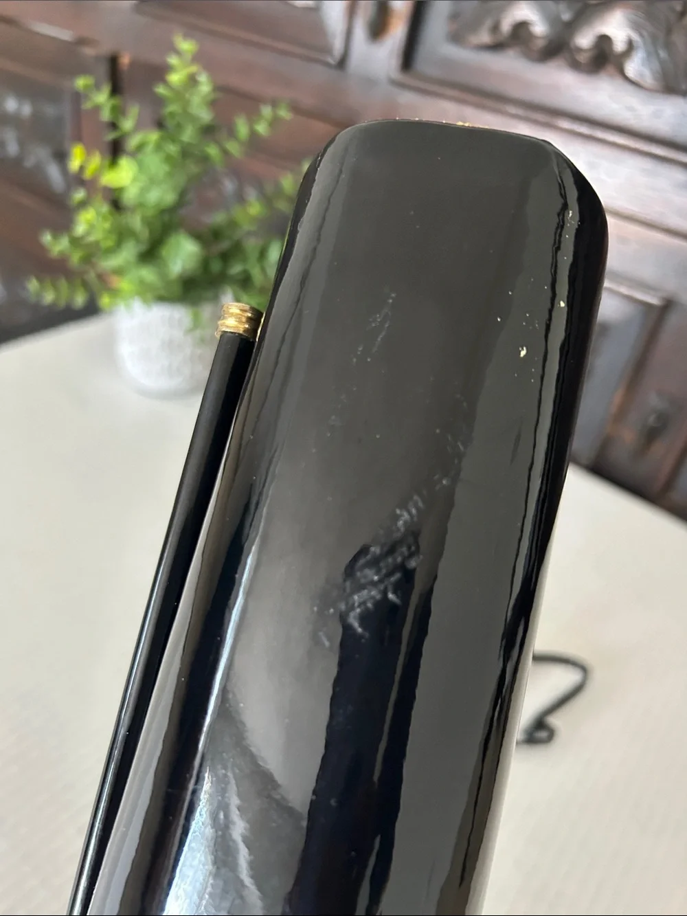 Ande Sleek Black Patent Crossbody with Gold Accent